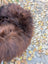 A plush large 49 by 31 natural dark rusty icelandic sheepskin throw with soft dense wool icelandic texture