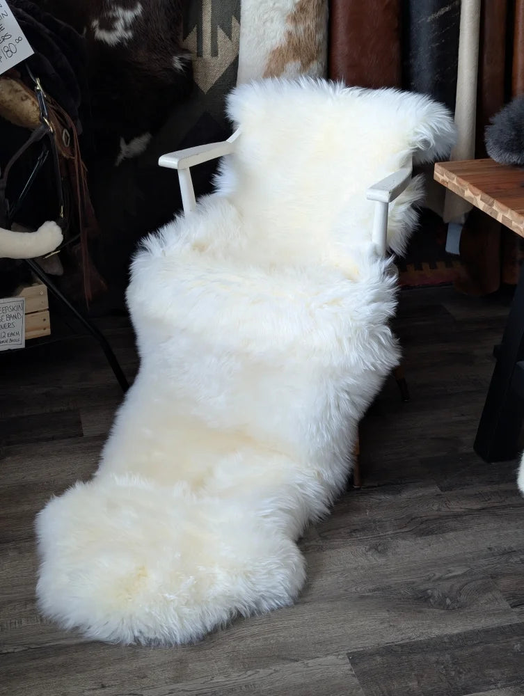 Oeko tex certified very soft merino double sheepskin on white armchair