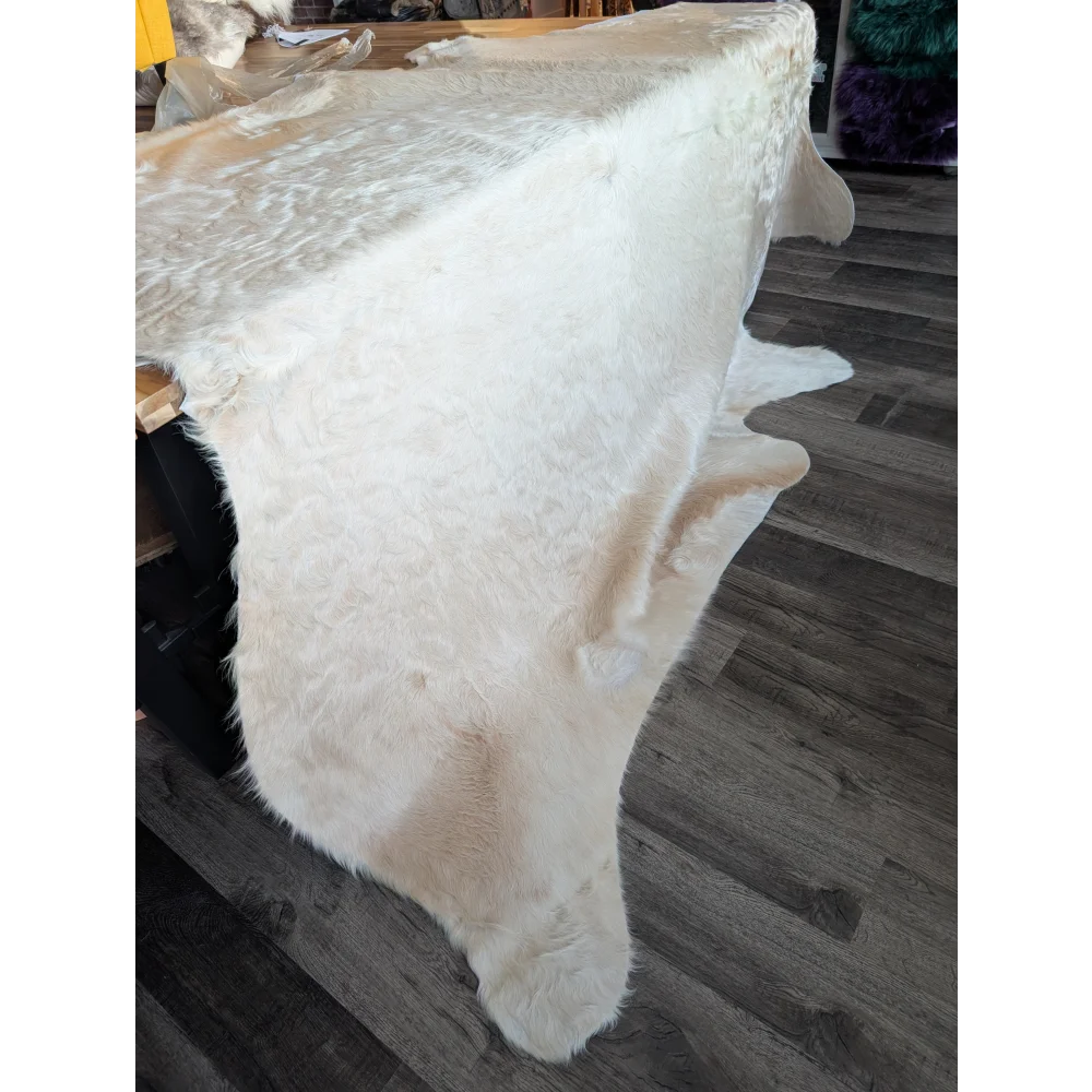 Very special white ivory cowhide #86 rug, soft underfoot with unmistakable aura
