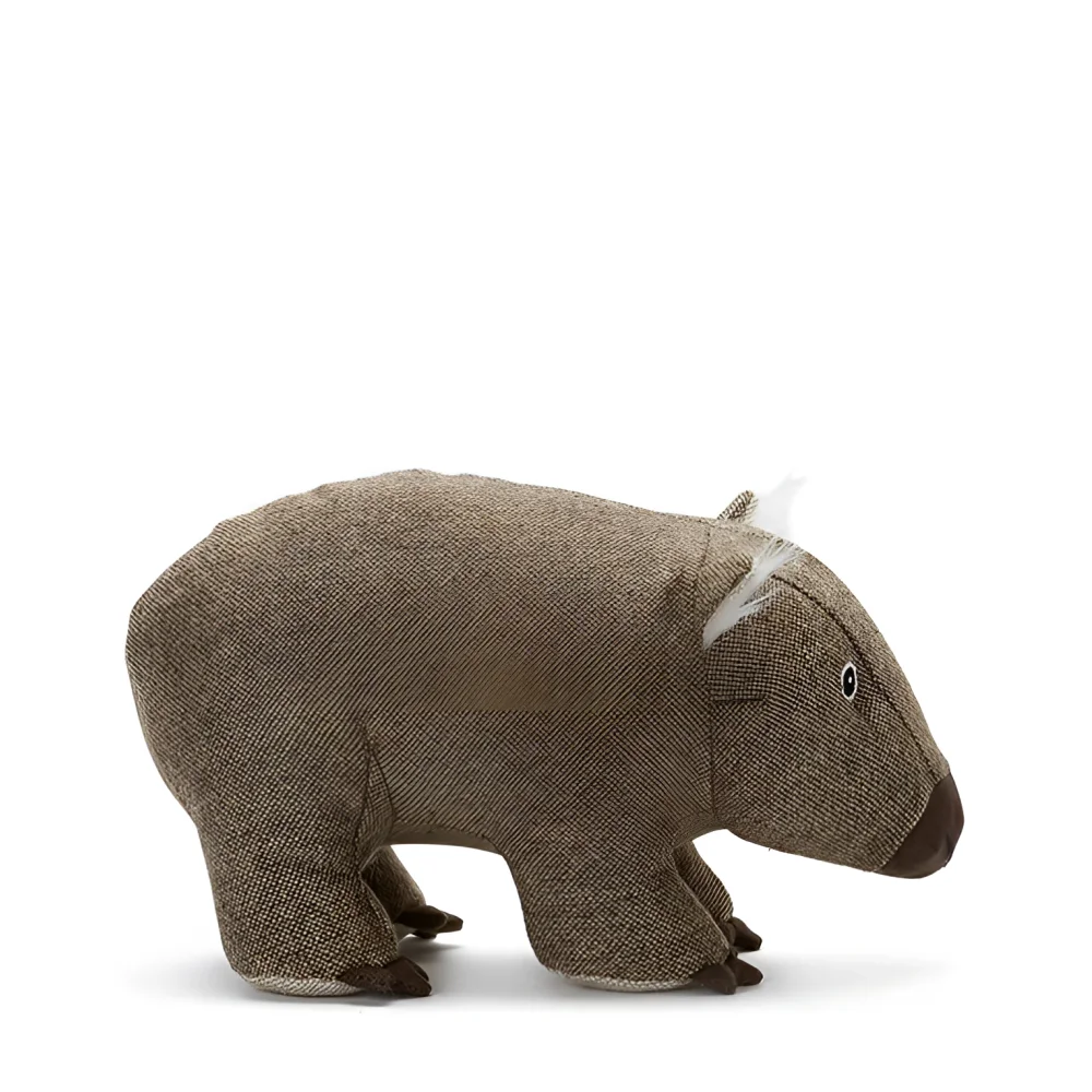 Wally the wombat plush toy made of brown textured fabric with white whiskers and a dark brown nose perfect with cowhide rugs