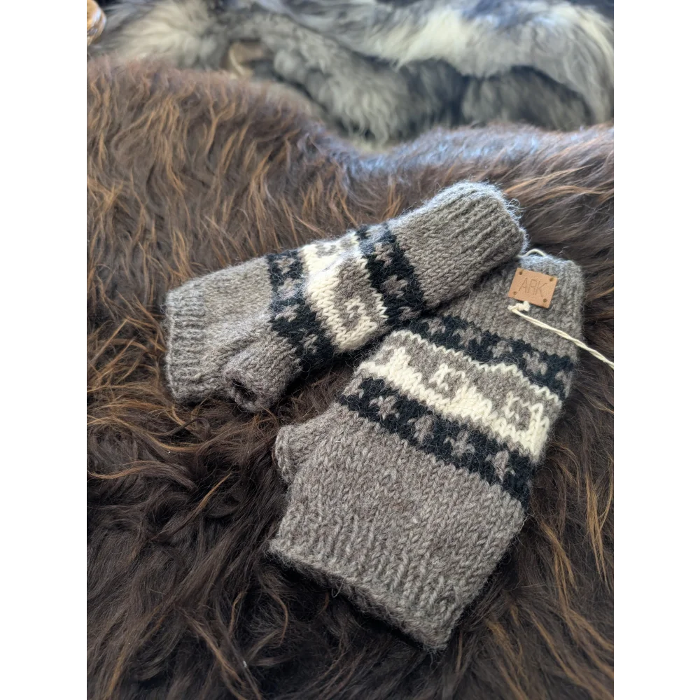 Grey and white Zealand wool wave hand warmers with knitted exterior and leather tag