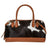 Westward hair-on hide Angus Oliver cowhide bag with tan leather handles