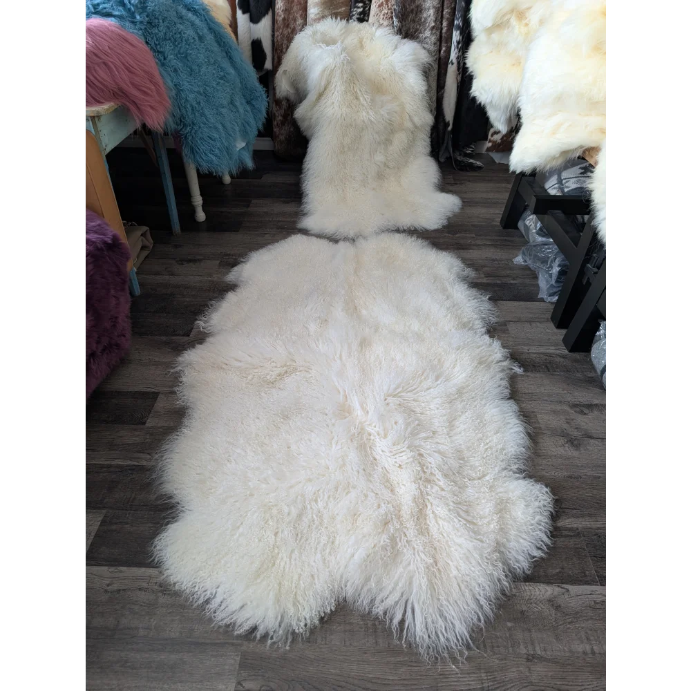 Gorgeous natural white Mongolian sheepskin rug on wood floor