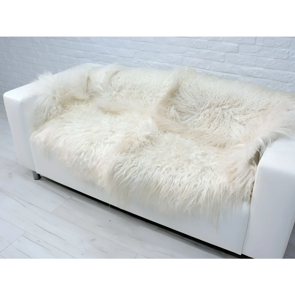 Angus Oliver white sheepskin rug with plush cream fur sofa and pillows