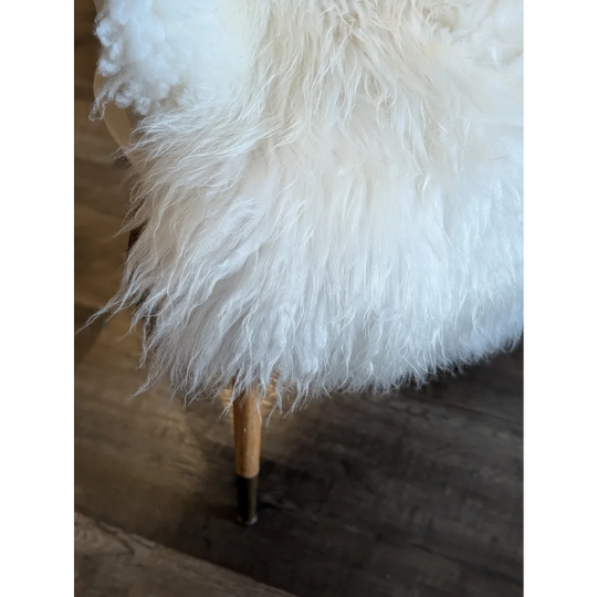 White fluffy sheepskin chair with wooden legs and black metal feet made from soft icelandic sheepskin rug 53x34 inches