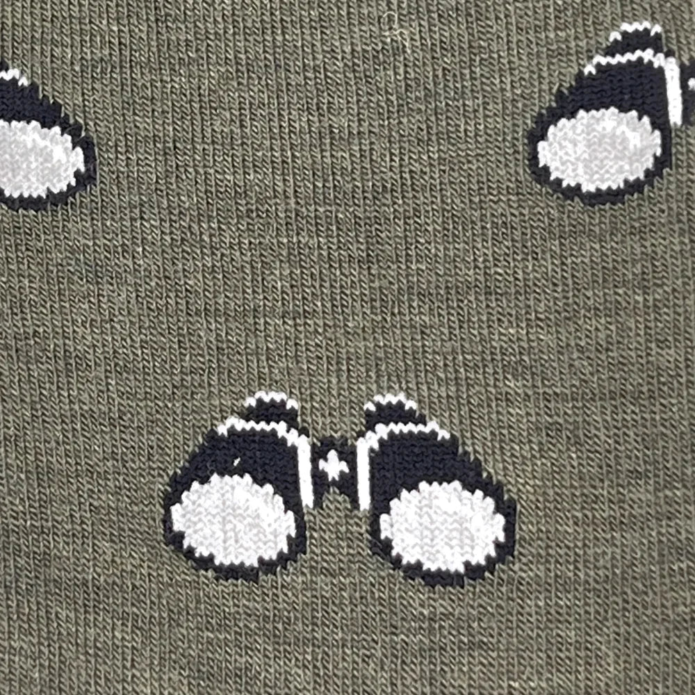 Women’s olive green merino wool socks with playful black and white binocular pattern all-season birdwatching design