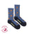 Women’s blue heathered merino wool socks with orange monarch butterfly prints and friday sock co branding on heel
