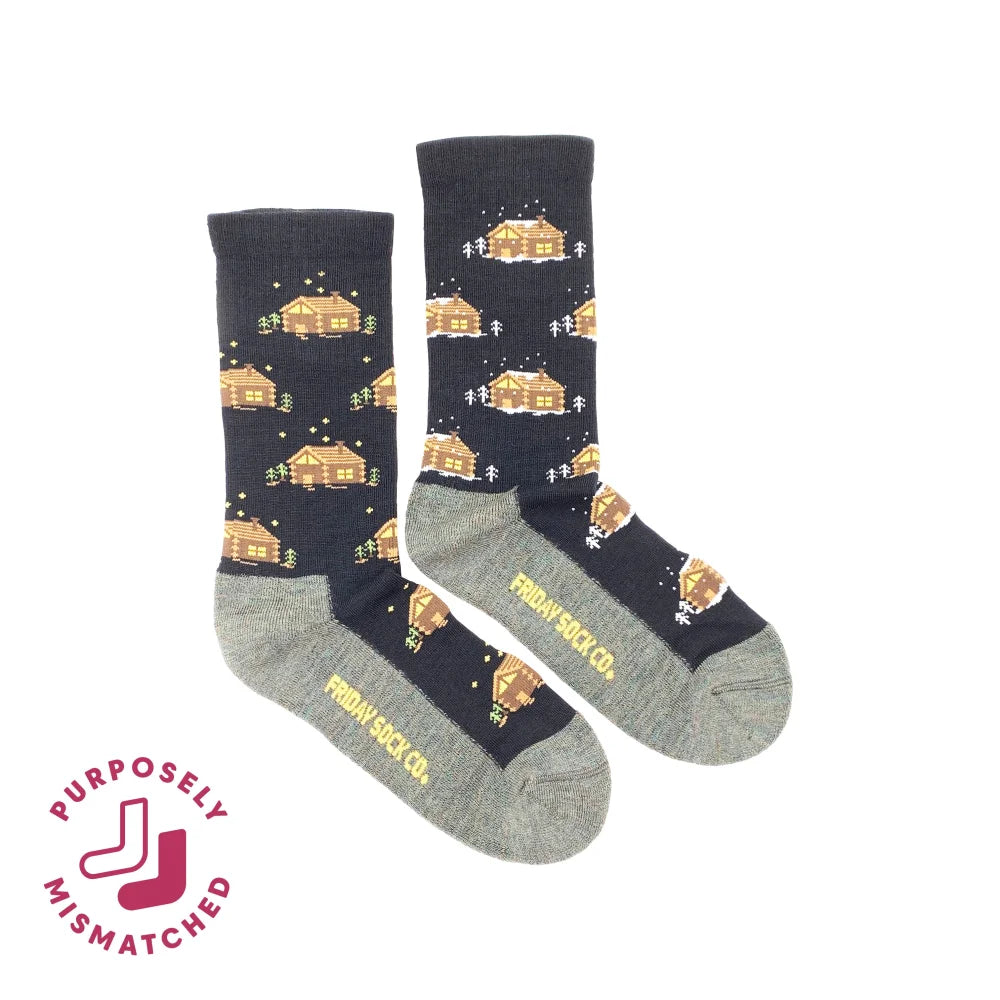 Black and gray women’s cabin merino wool socks with pixelated cozy cabins snow trees and stars by angus oliver