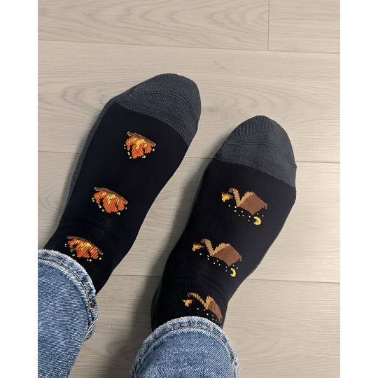 Women’s camping at night merino wool socks in black with gray toes and pixelated orange pumpkin designs by angus oliver