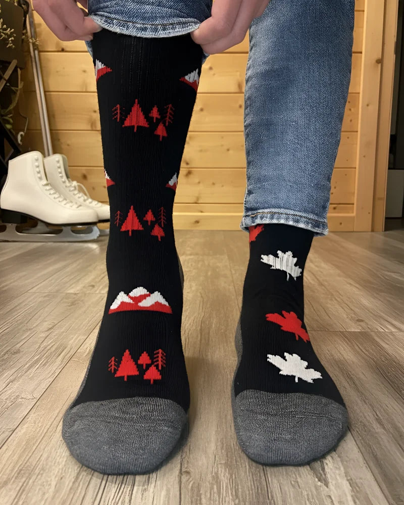 Black merino wool knee-high socks with red white forest mountain patterns and gray toe cap for warm hiking by angus oliver