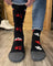 Black merino wool knee-high socks with red white forest mountain patterns and gray toe cap for warm hiking by angus oliver