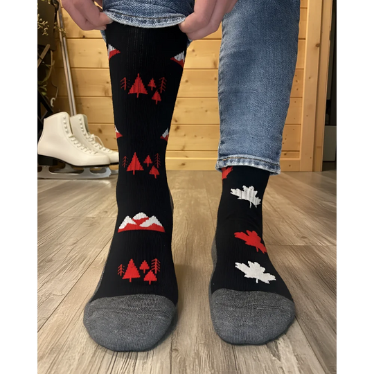 Black merino wool knee-high socks with red white forest mountain patterns and gray toe cap for warm hiking by angus oliver