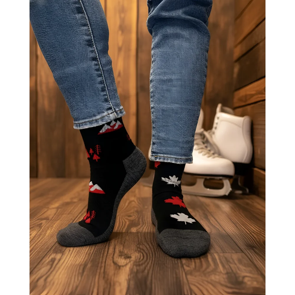 Women’s canada merino wool socks in black with red and white maple leaf patterns, gray toes, perfect for hiking