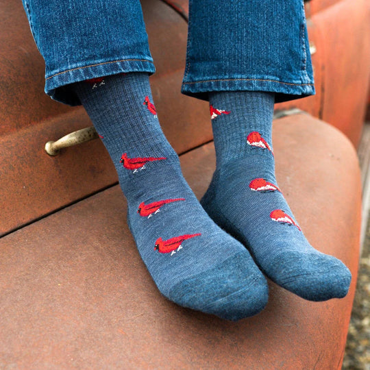 Women’s Cardinal & Robin merino wool socks with blue bird design on denim