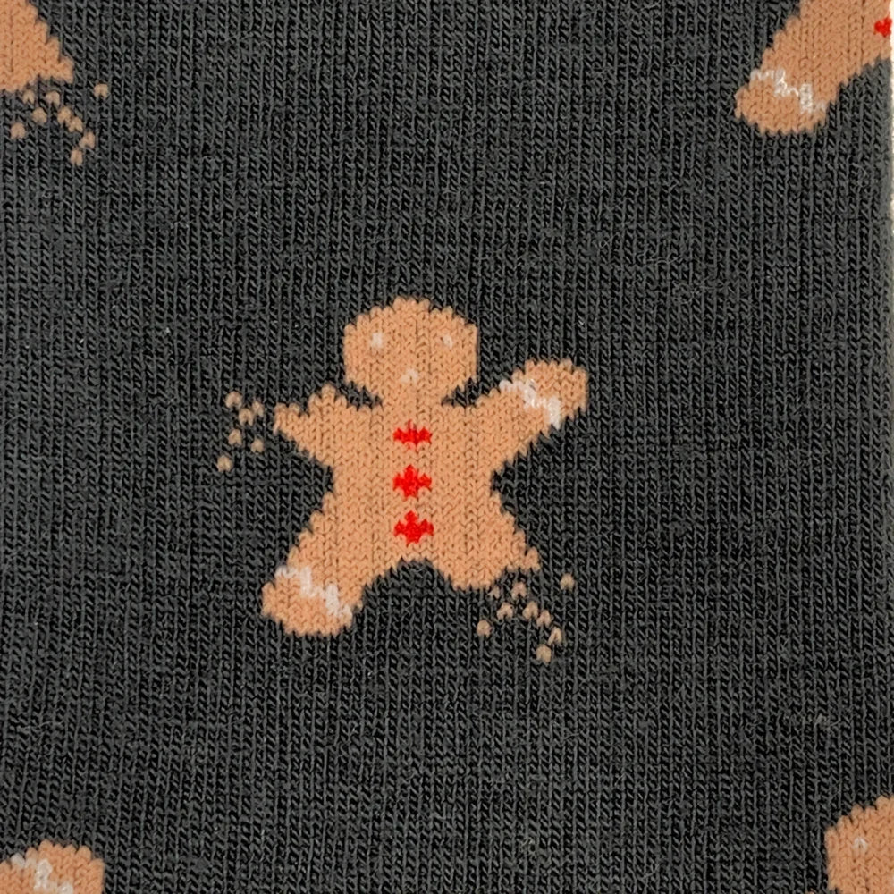 Dark gray merino wool socks with tan gingerbread man and red maple leaf details for cozy outdoor wear