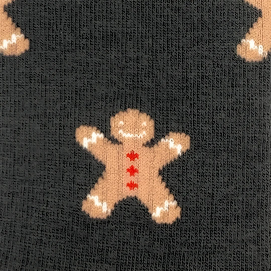 Women’s gingerbread bite merino wool socks with knitted gingerbread man design in tan red and white perfect for cozy days