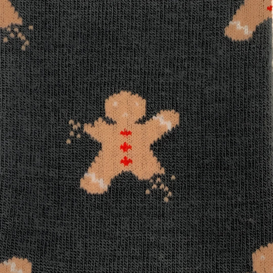 Dark gray merino wool socks for women featuring a tan gingerbread man with red icing and white sugar sprinkle accents