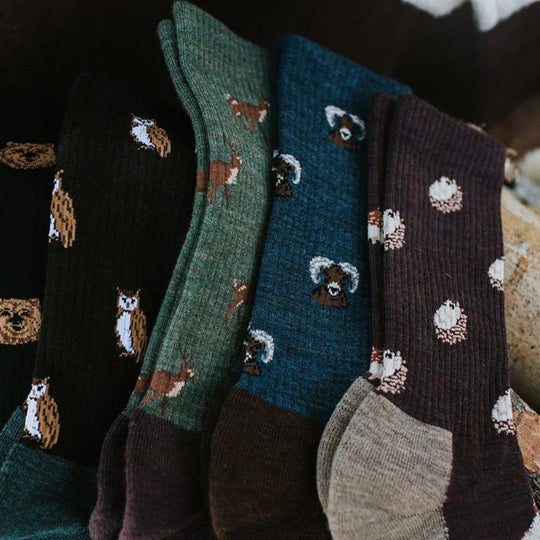Cozy women’s merino wool socks in earthy tones with embroidered woodland animals offering breathable warmth