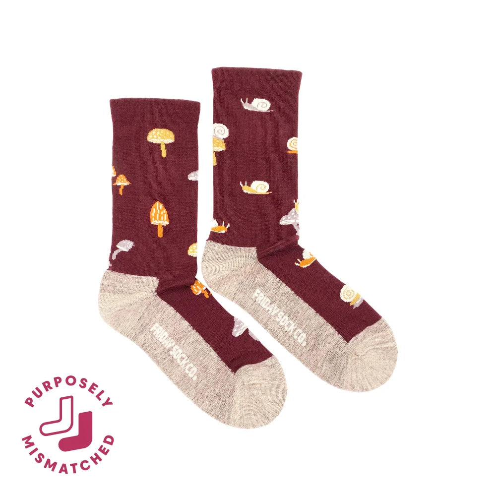 Women’s maroon merino wool socks with yellow mushroom and white snail pattern and beige toe and heel for comfy hiking