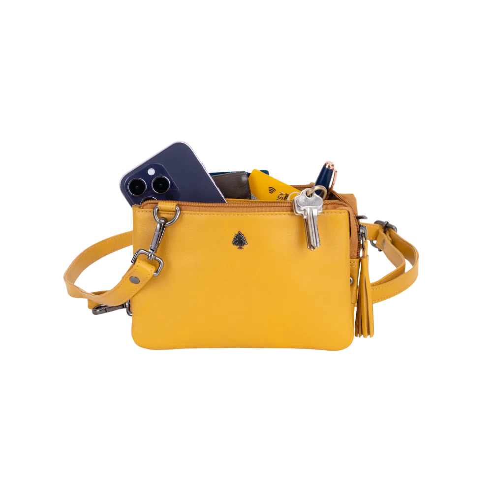 Vibrant yellow Angus Oliver Ruby shoulder bag with zipper and tassels