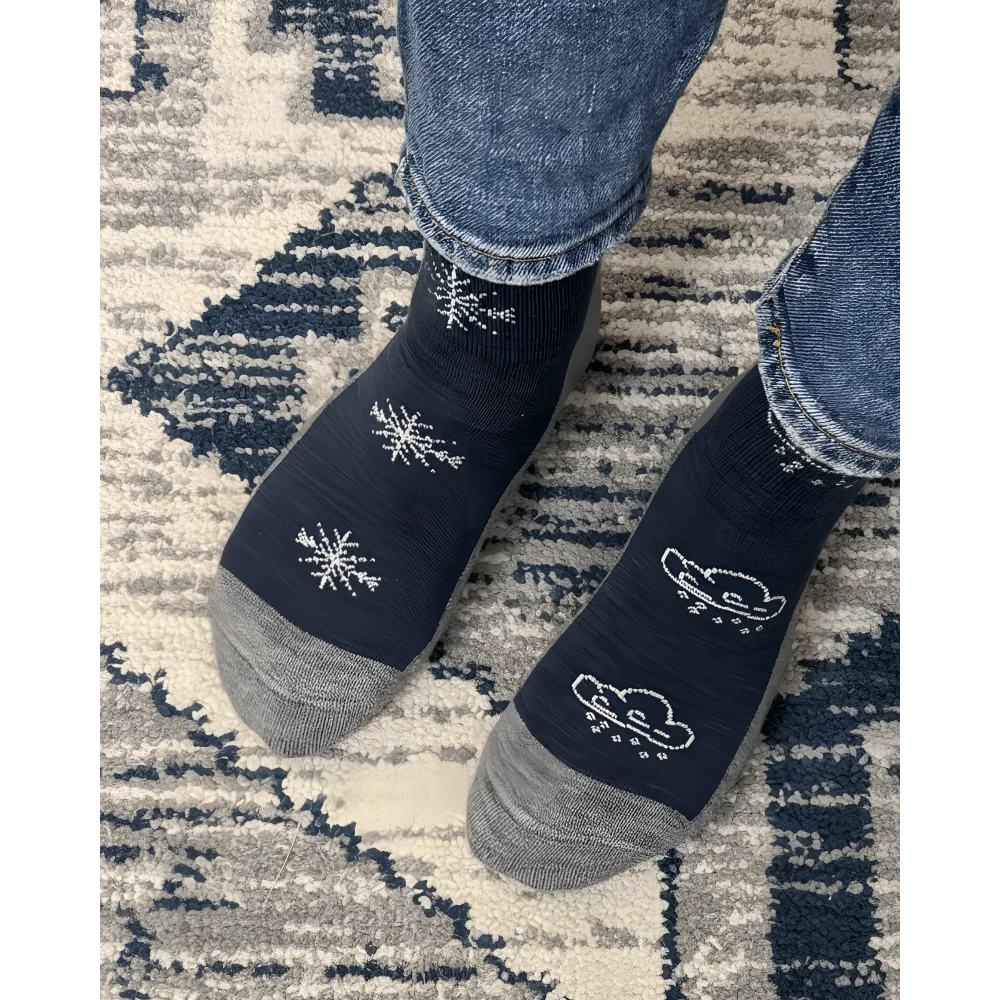 Women’s winter merino wool socks in dark blue with gray toes heels and white snowflake cloud designs by angus oliver