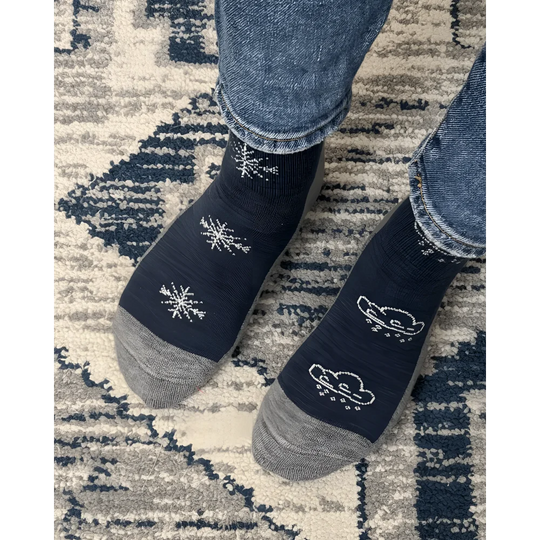 Women’s winter merino wool socks in dark blue with gray toes heels and white snowflake cloud designs by angus oliver
