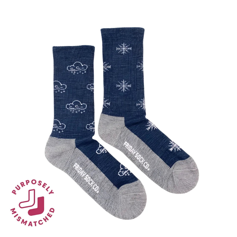 Women’s winter merino wool socks in navy blue with white clouds and snowflakes, gray toes and heels by angus oliver