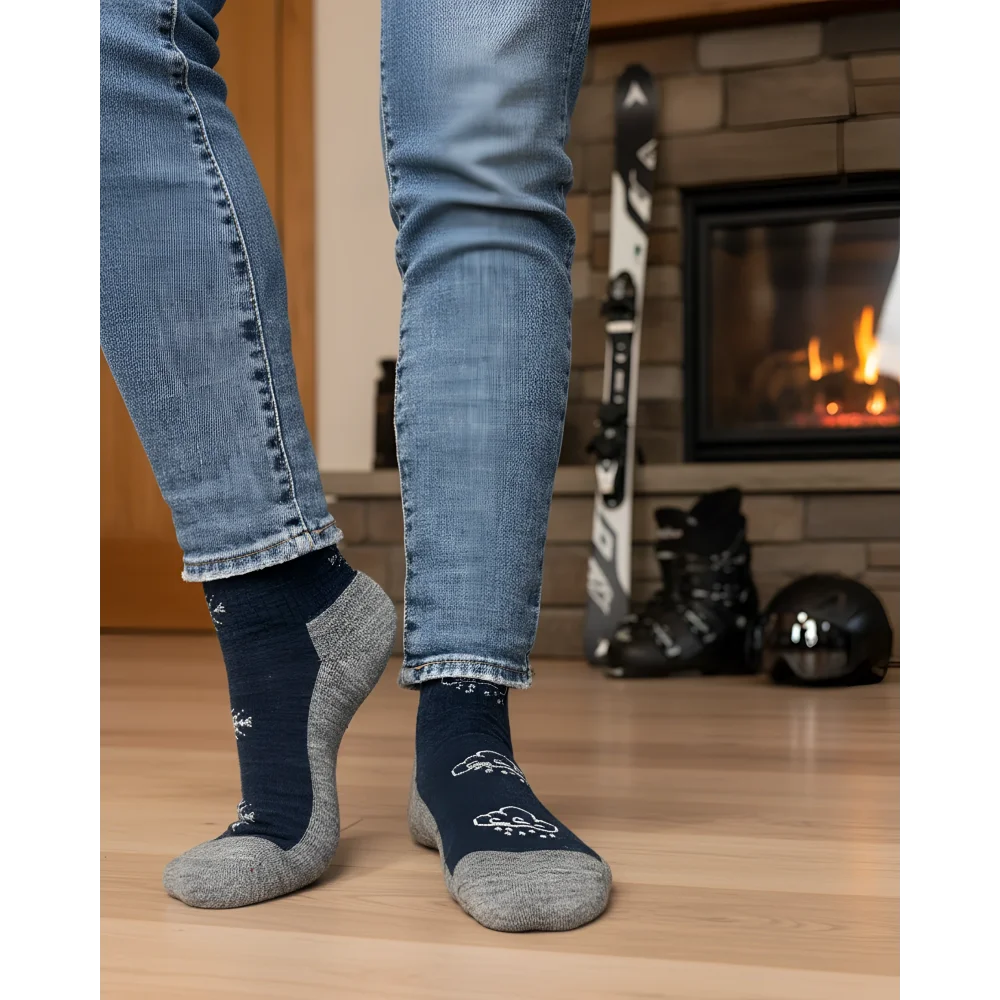 Women’s winter merino wool socks in navy blue and gray with white snowflake patterns for cozy cold weather comfort