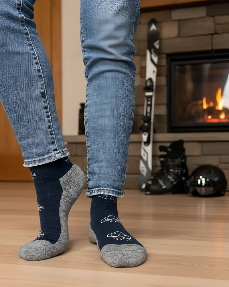 Women’s winter merino wool socks in navy blue and gray with white snowflake patterns for cozy cold weather comfort