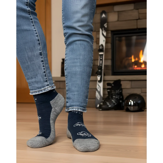 Women’s winter merino wool socks in navy blue and gray with white snowflake patterns for cozy cold weather comfort