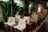 Wooden chairs draped with cream-colored sheepskin blankets.