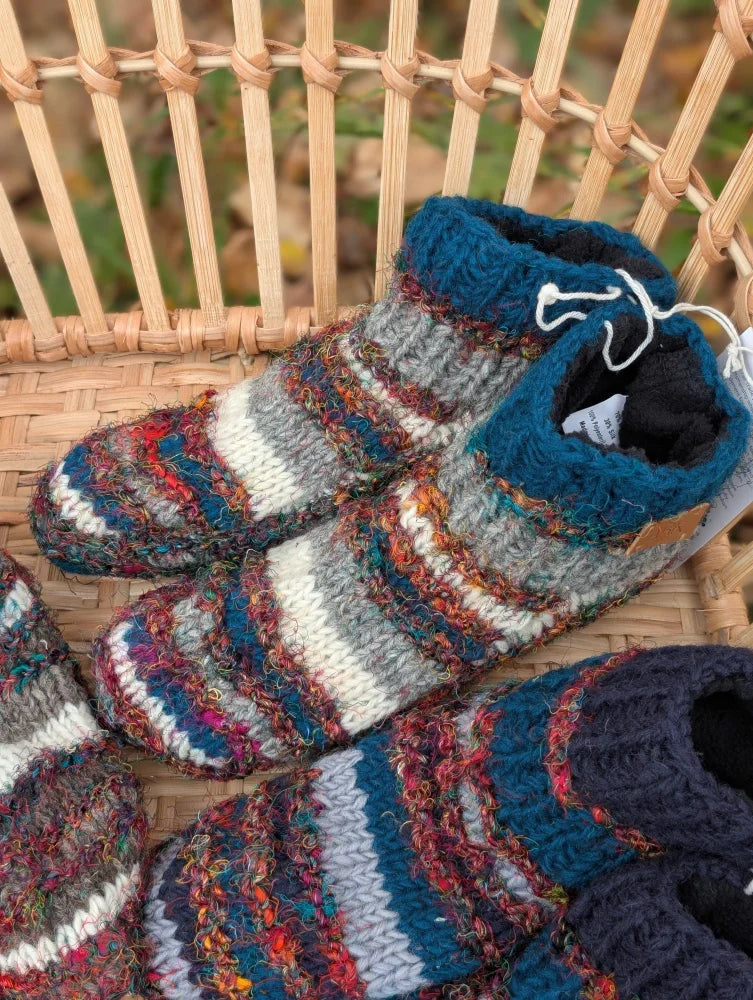 Cozy woolen adult sized booties in swool stripe wool with multicolored teal gray white and earthy tones stripes