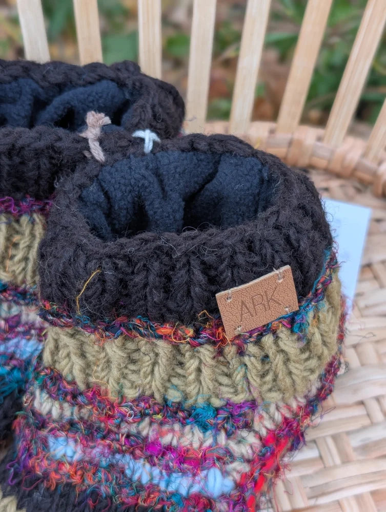 Woolen adult sized chunky knit stripe wool booties with colorful multicolored swool stripe pattern and black cuffs