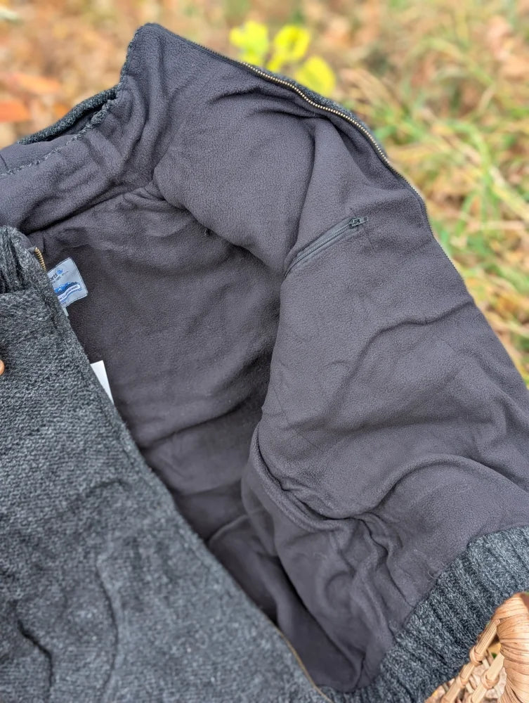 Dark gray woolen calgary cardigan with textured zealand wool, cozy fleece lining, ribbed cuffs, and attached hood