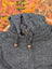 Cozy dark gray woolen calgary cardigan with attached hood, wooden toggle drawstrings, and brass zipper