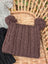 A cozy brown woolen heelah double pompom hat with cable knit texture and fluffy double pompoms on top