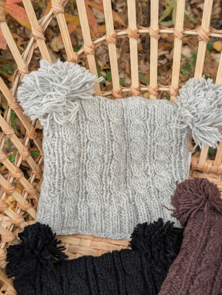 Gray woolen heelah double pompom double pompom hat with cable knit texture and fluffy side pom poms