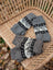 Gray knitted fingerless woolen wave hand warmers with black and white fair trade geometric patterns by angus oliver