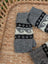 Gray knitted woolen wave hand warmers with black and white nordic patterns fair trade angus oliver fingerless mittens