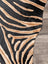 Gorgeous zebra printed cowhide rug by angus oliver with black and tan zebra print and soft textured faux fur surface