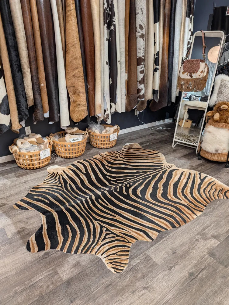 Black and tan zebra printed cowhide rug with unique characteristics from angus oliver large cowhide collection
