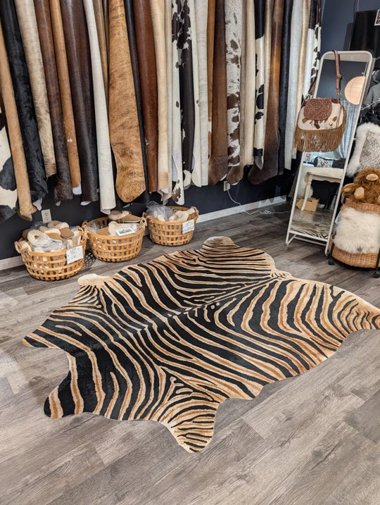 Black and tan zebra printed cowhide rug with unique characteristics from angus oliver large cowhide collection