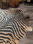 Black and tan zebra print large cowhide rug by angus oliver with unique characteristics for stylish decor
