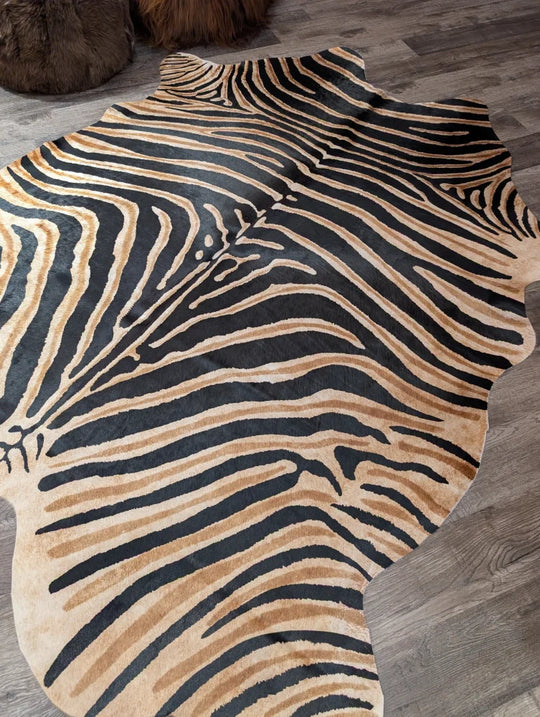 Gorgeous zebra printed cowhide rug by angus oliver with bold black and tan stripes and unique large cowhide texture
