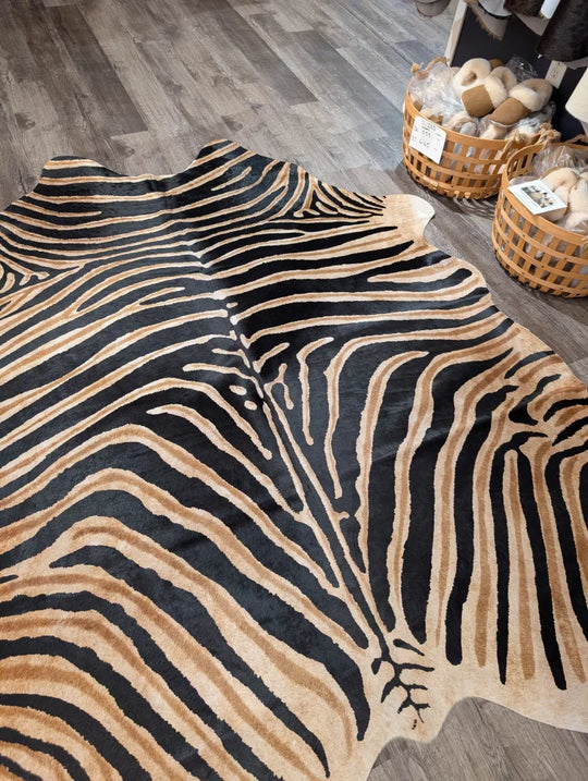 Gorgeous zebra printed large cowhide rug with black and tan zebra striped faux fur by angus oliver with unique characteristics