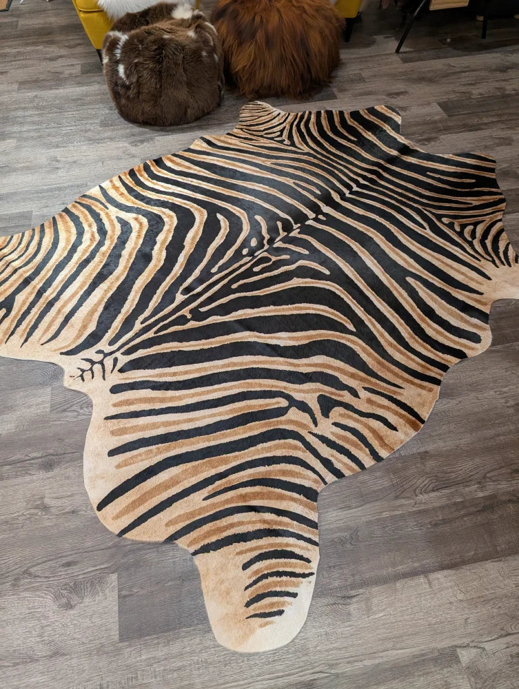 Gorgeous zebra printed cowhide rug by angus oliver with unique characteristics in bold black and tan faux leather