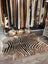 Gorgeous zebra printed large cowhide rug with bold black and tan stripes showcasing unique characteristics by angus oliver