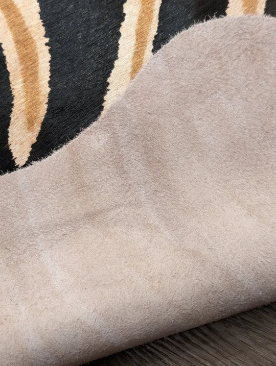 Beige suede fabric with soft plush texture and fuzzy surface showing unique characteristics in angus oliver large cowhide