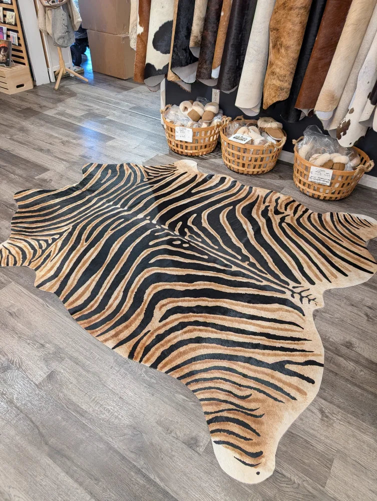 Gorgeous zebra printed large cowhide rug by angus oliver with bold black and tan stripes showing unique characteristics