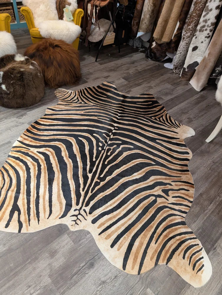 Gorgeous zebra printed large cowhide rug by angus oliver with bold black and tan stripes showing unique characteristics